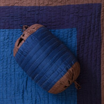 Textured blue and brown fabric with a woven pattern